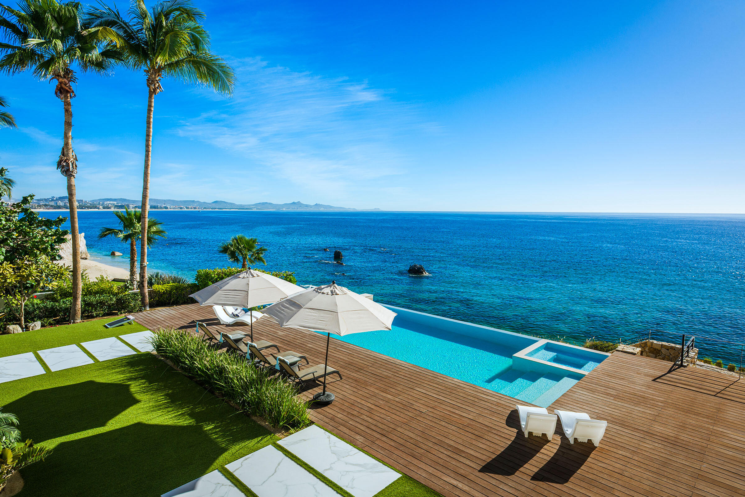 Los Cabos Luxury La Caleta Casa Hendo is a stunning oceanfront estate perched above a swimmable cove, offering breathtaking Sea of Cortez for sale
