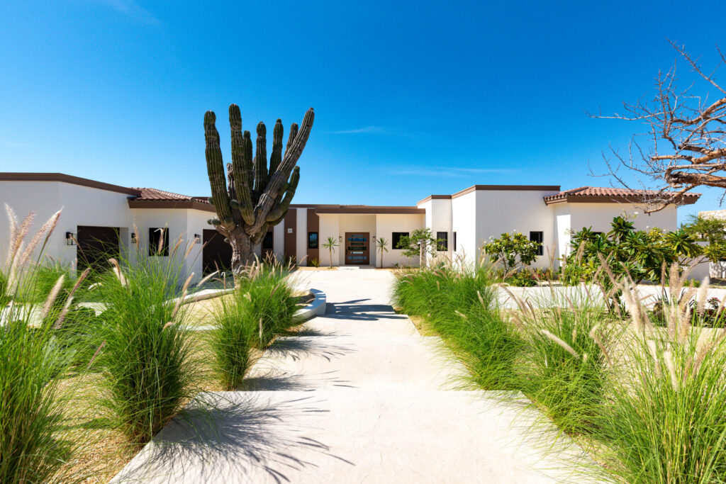 Los Cabos Luxury Sunset Hill Setting a new benchmark for modern design at Diamante, this truly exceptional five-bedroom, five-bathroom residence embodies the pinnacle of contemporary luxury. With an elevated aesthetic, the home utilizes state-of-the-art 3D foam panel construction to ensure remarkable environmental comfort, structural durability, and minimal long-term maintenance. Outfitted with a professional-grade suite of Wolf, Sub-Zero, and Zephyr appliances, the interior is a fully realized, turn-key masterpiece offering immediate access to the exclusive Diamante lifestyle. The open-concept living spaces are defined by a seamless indoor-outdoor flow, drawing the eye toward breathtaking sunset – 29 Boulevard Diamante, Pacific, BS