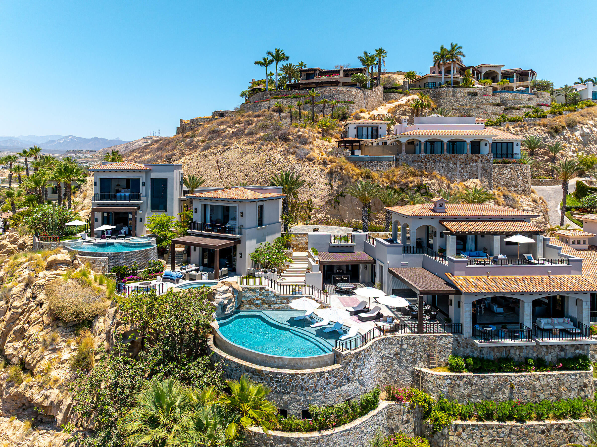 Los Cabos Luxury Villas Del Mar Casa Amore, a five-bedroom, four-full and four-half-bathrooms villa, is perched on a hilltop with for sale