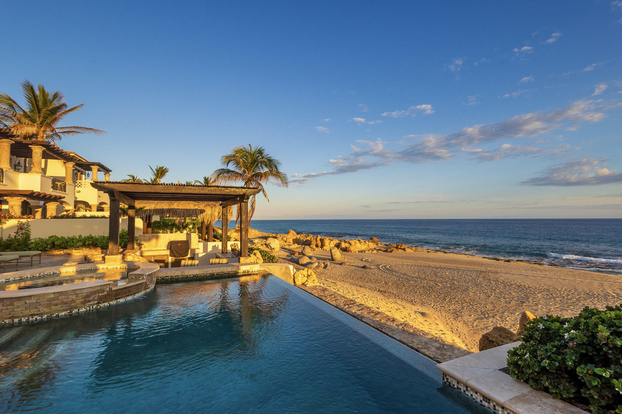 Los Cabos Luxury El Encanto Casa Cielo — Beachfront Hacienda Luxury in El Encanto de La LagunaCasa Cielo presents a rare opportunity to experience true beachfront living in the prestigious community of El Encanto de La Laguna. This 4-bedroom, 4-bathroom private villa blends timeless Hacienda architecture with refined, modern luxury finishes, all set on a pristine stretch of sand with panoramic ocean for sale