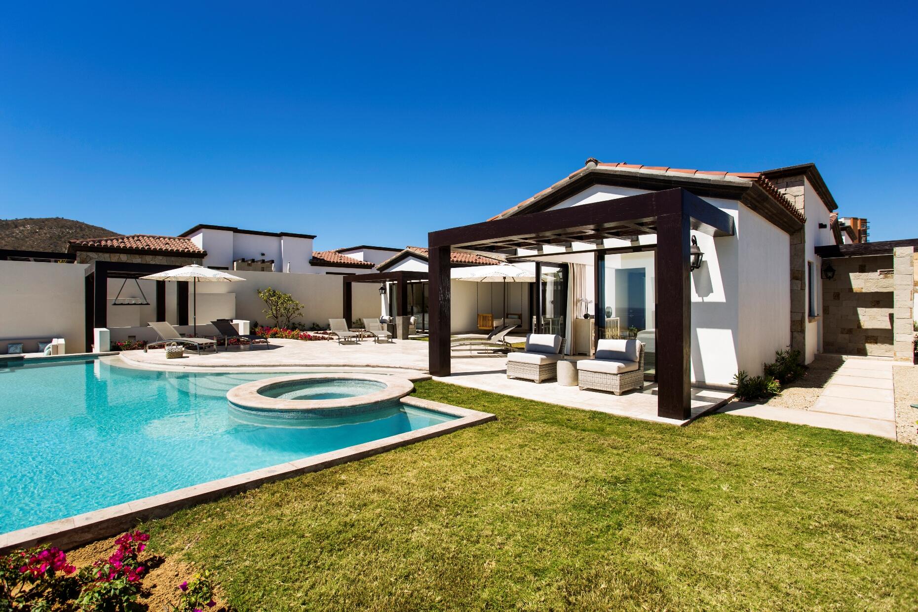 Los Cabos Luxury Coronado Espejo 4 bed home plan , this floorplan boasts a great room with vaulted ceilings over the living/dining/kitchen area which looks out over the large covered terrace and the hand-made infinity edge pool beyond. The chefs kitchen with huge island with seating boasts Wolf and Sub-Zero appliances. The master and guest master have large ensuite baths w/ shower and tubs, and also both have ocean for sale