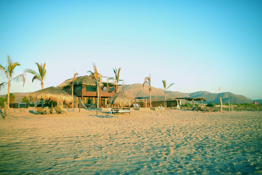 Los Cabos Luxury Cerritos For sale: A remarkable property in South Cerritos Beach. Spanning an impressive 3,470 m2, this lot includes two buildings with eight units, each adorned with traditional palapa roofs. The owner has meticulously prepared and enhanced the land, creating a level and expansive area extending towards the beachfront. This unique offering presents limitless potential, suitable for a family compound. The property is entirely self-sustaining, equipped with solar panels, water cistern, and septic systems, ensuring a harmonious blend with its natural surroundings. Located just 1.5 miles from the main surf break and in close proximity to local restaurants, this is an exceptional opportunity for those seeking a blend of tranquility and accessibility. – South Cerritos, Pacific, BS