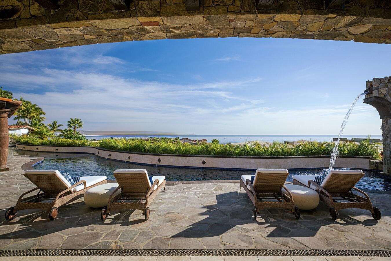 Los Cabos Luxury Palmilla Cove Villa Encanto, located at Palmilla Cove 5, offers a traditional design with hints of Old Hacienda Architecture, captured in the stone façade and archways throughout. The home offers a calming neutral palette, comfort, and practicality.A bit of wow comes into play with the 100' plus sprawling pool. Flowing the length of the home, the pool features a centrally located sunken spa, wet shelf, spitter fountains and cascading waterfall. Multi outdoor gathering spots are scattered throughout, offering places for lounging or leisurely long lunches, and even sneaking away to a quiet spot.The approach with the interior was to capture the ocean for sale