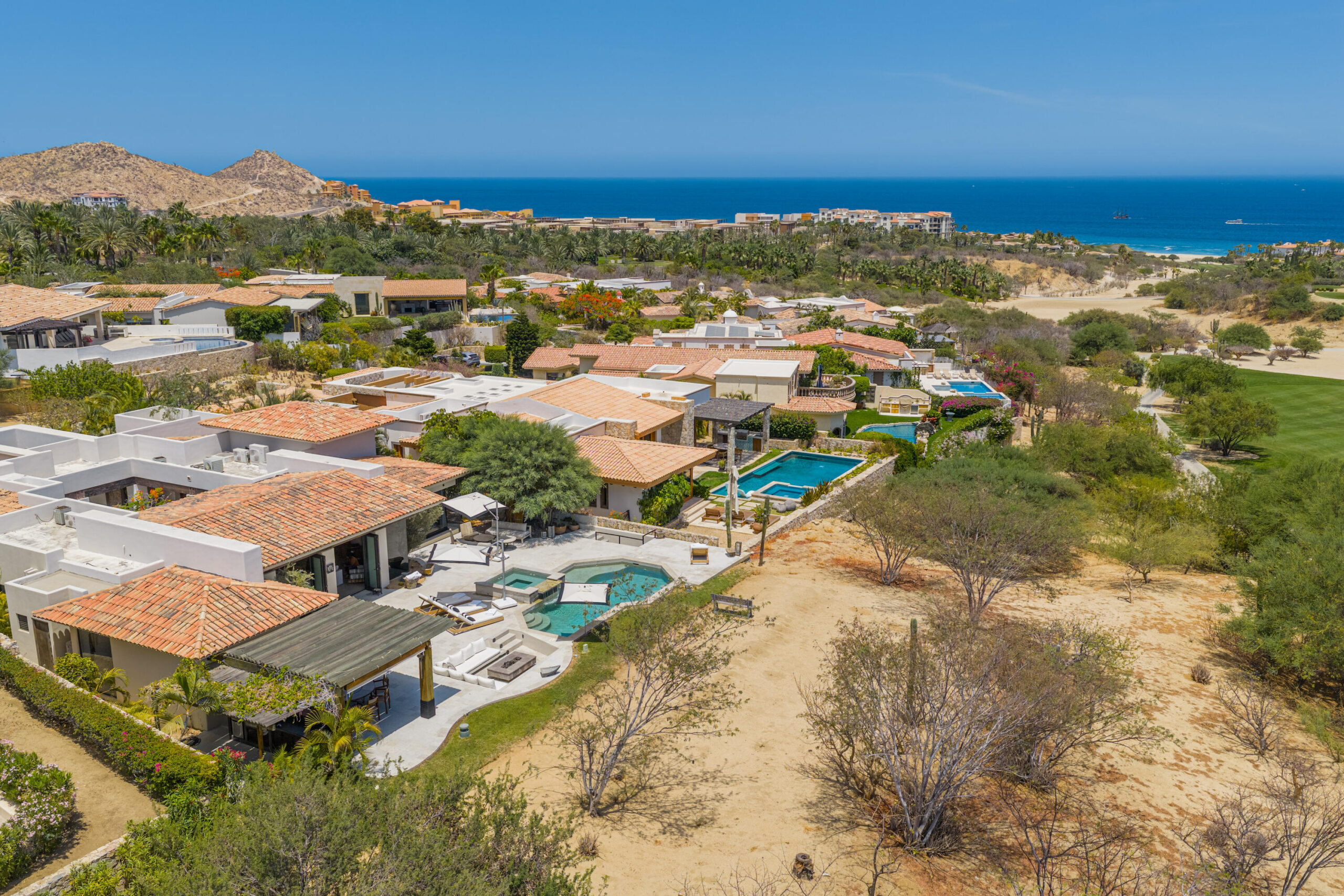 Los Cabos Luxury Brisas Discover Naah Payil, an exceptional estate where the warmth of a Contemporary Mexican Hacienda blends seamlessly with the relaxed sophistication of coastal living. Located within one of Los Cabos' most exclusive and secure communities, this architectural masterpiece was custom-designed by MCA, led by renowned architect Antonio Carrera. Thoughtfully enhanced in 2015 and again in 2025, the residence beautifully balances timeless character with today's highest standards of comfort and design. At the heart of the home, a central courtyard anchored by a signature tree creates a tranquil gathering space filled with natural light. The home's thoughtful design embraces effortless indoor-outdoor living. Open the grand living room doors, and refreshing ocean breezes naturally flow throughout the residence, creating a comfortable and inviting atmosphere – 12 Cabo del Sol Brisas, Cabo Corridor, BS